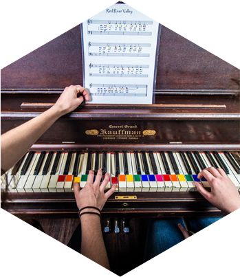 Playing the piano in The Saloon Escape Room